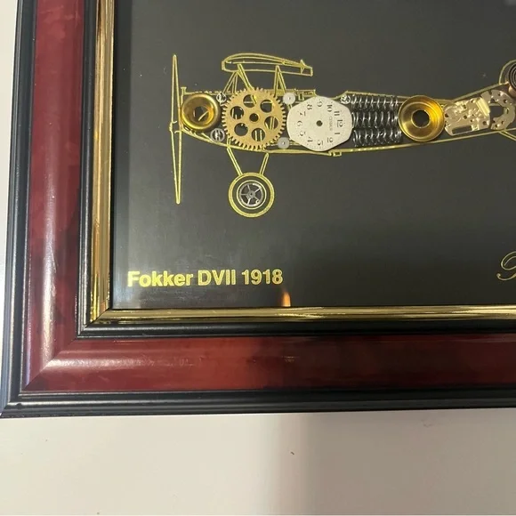 framed piece of art featuring a representation of an airplane with clock pieces - Picture 4 of 10